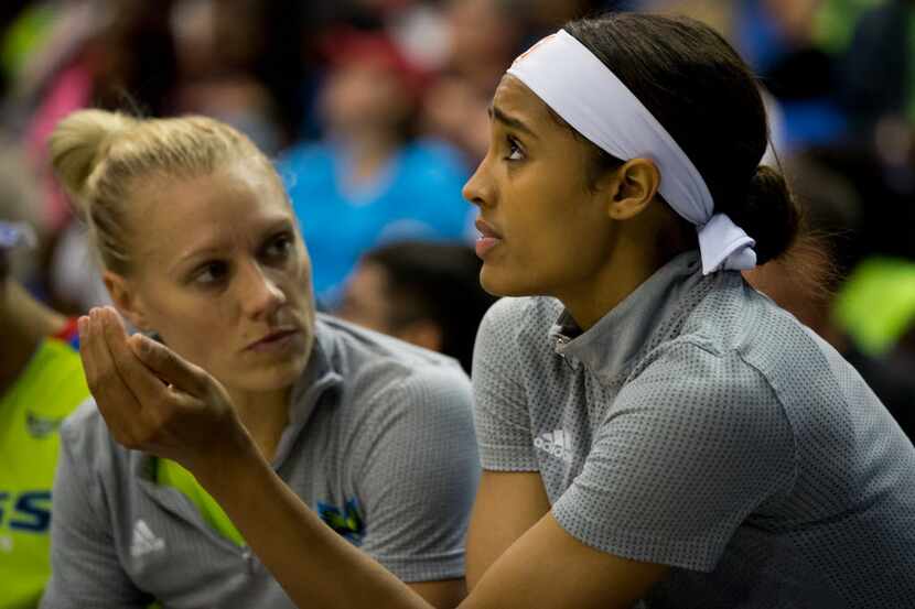 Dallas Wings guard Skylar Diggins (4) chats with teammate Erin Phillips (31) on the bench...