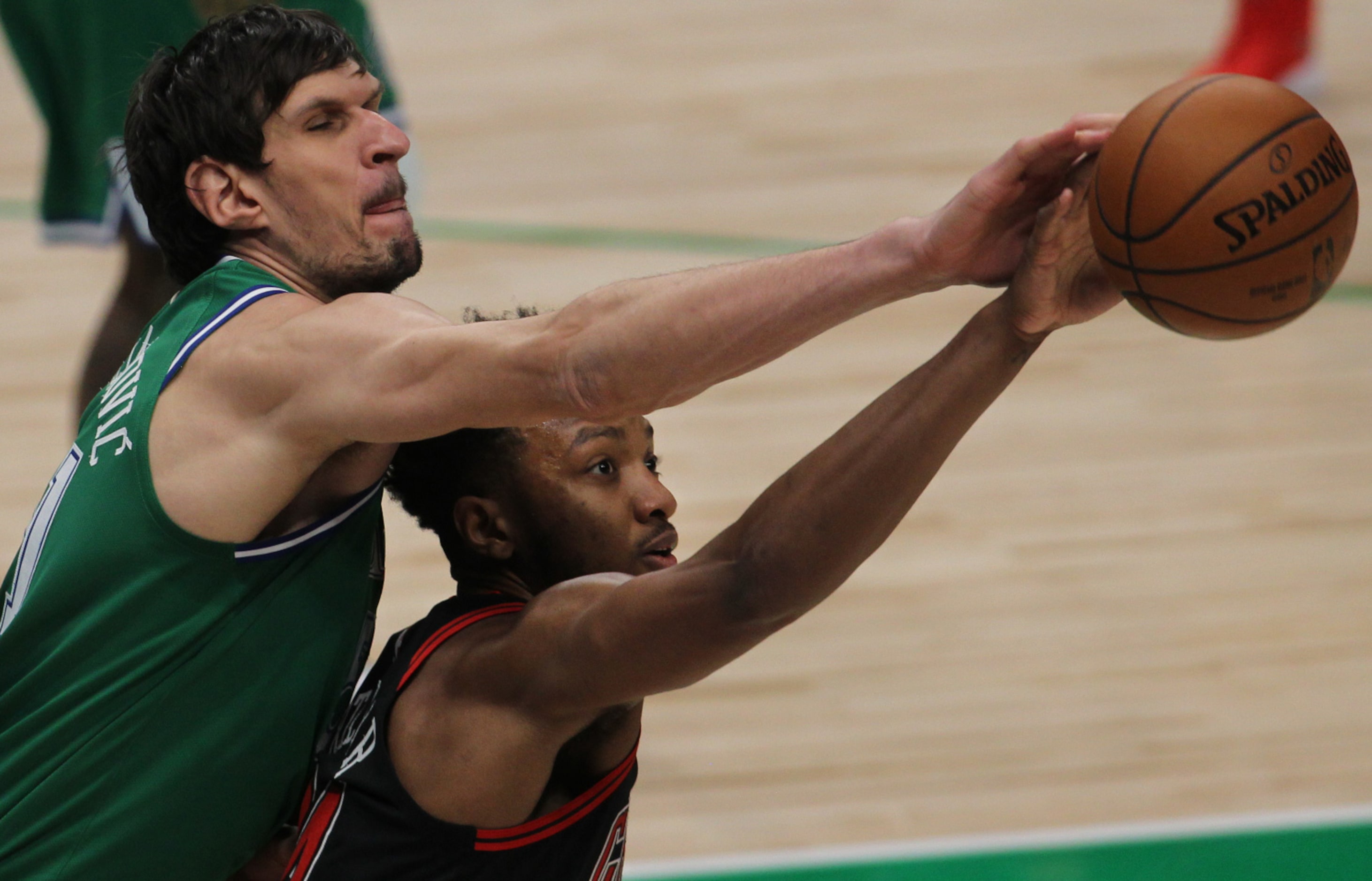 Dallas Mavericks center Boban Marjanovic (51) reaches to knock the ball away from Chicago...