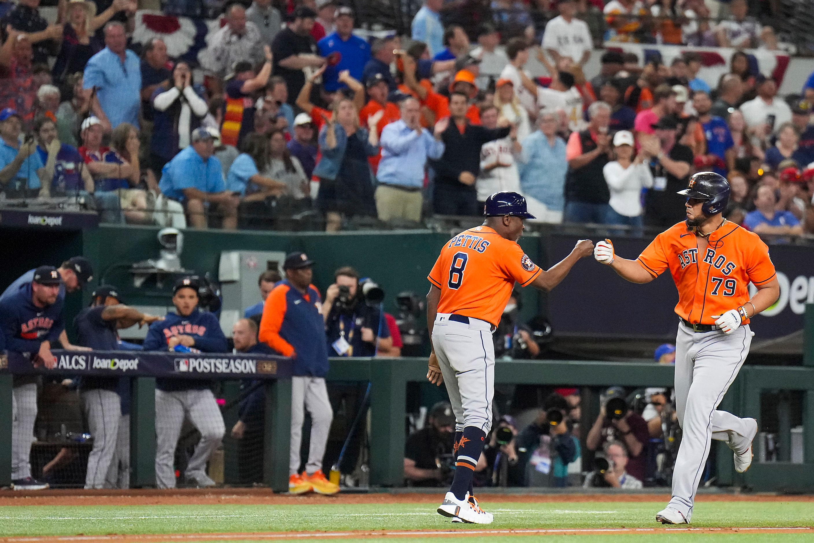 Houston Astros first baseman Jose Abreu celebrates with third base coach Gary Pettis after...