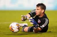 FC Dallas goalkeeper Maarten Paes (30) makes a save during the first half of an MLS soccer...