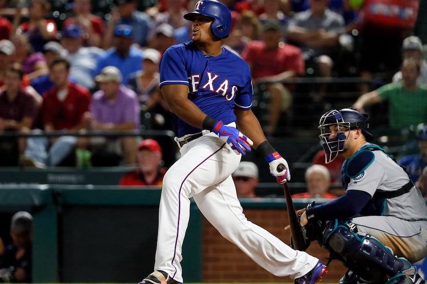 Texas Rangers' Adrian Beltre follows through on a ground out to third as Seattle Mariners'...