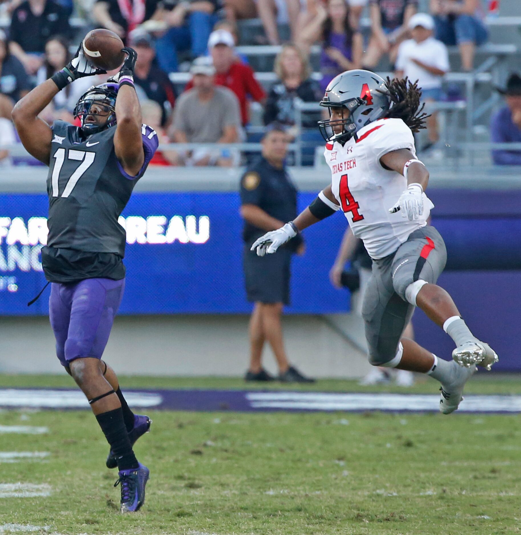 TCU safety Sam Carter (17) intercepts a pass intended for Texas Tech Red Raiders wide...