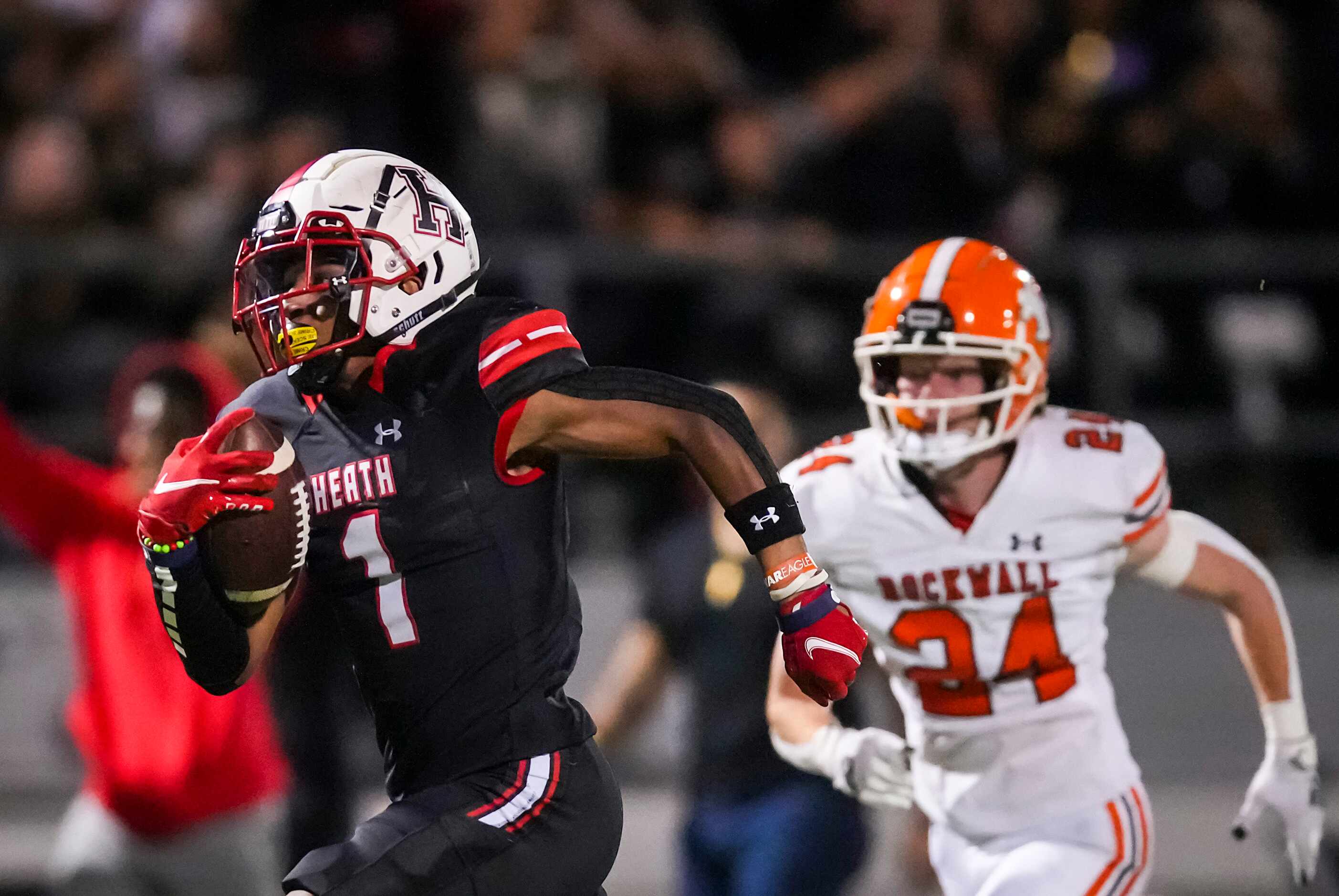 Rockwall-Heath wide receiver Jay Fair (1) races to the end zone on a 69-yard touchdown...
