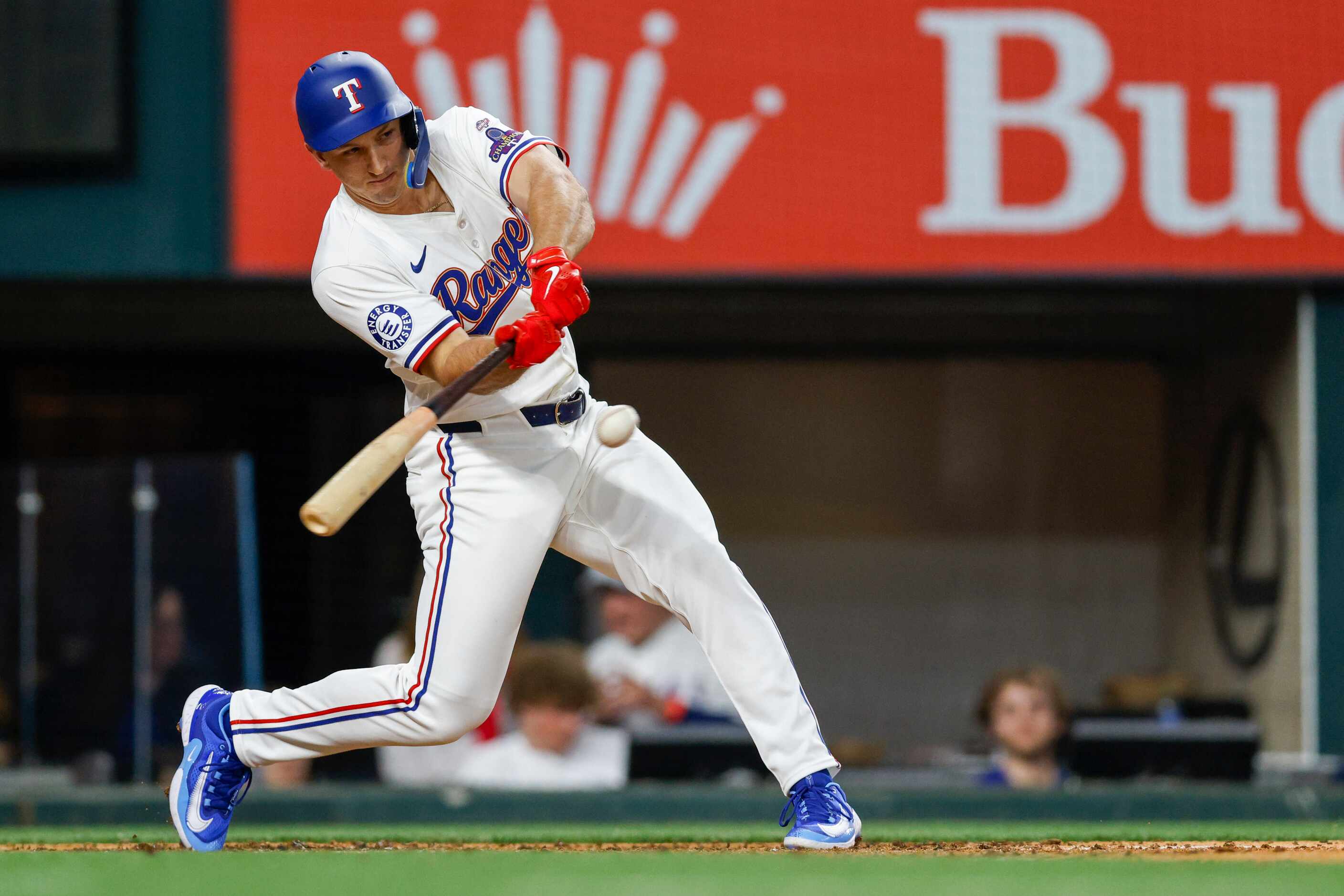 Texas Rangers designated hitter Wyatt Langford (36) hits a sacrifice fly to centerfield to...