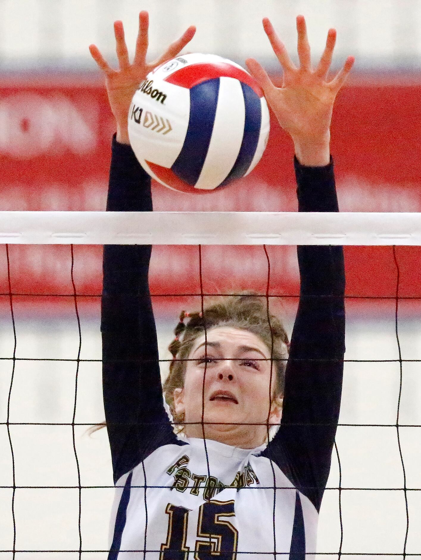 Prestonwood Christian Academy right side hitter Emma Kate Mullican (15) gets a block in game...