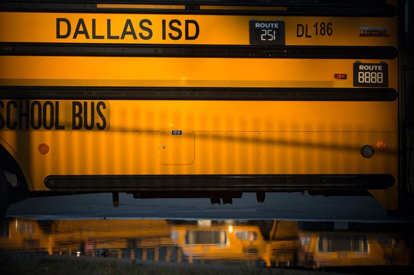 A Dallas Independent School District school bus parked at the district's bus lot in Dallas...