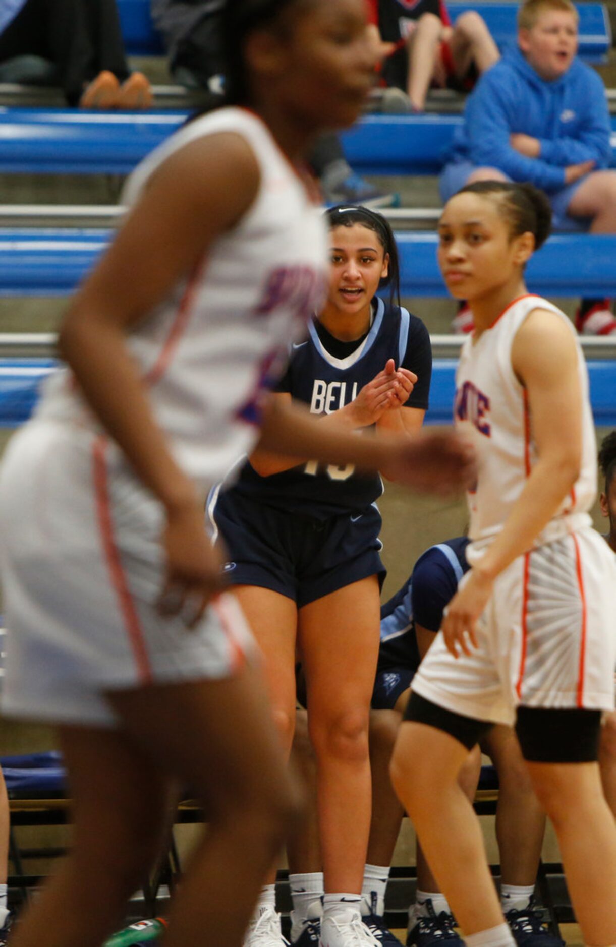 Hurst L.D. Bell guard Myra Gordon (15) applauds the efforts of teammates during a break on...