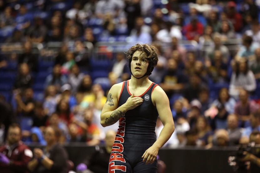 Euless Trinity's Mack Beggs, a transgender male, looks to the crowd after winning the state...