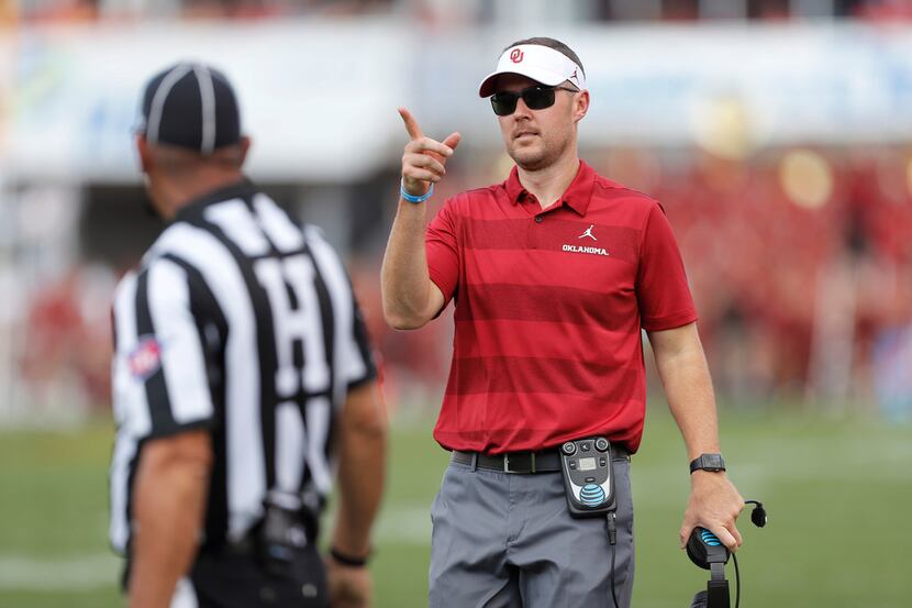 Oklahoma head coach Lincoln Riley, right, calls for a review of play during the second half...