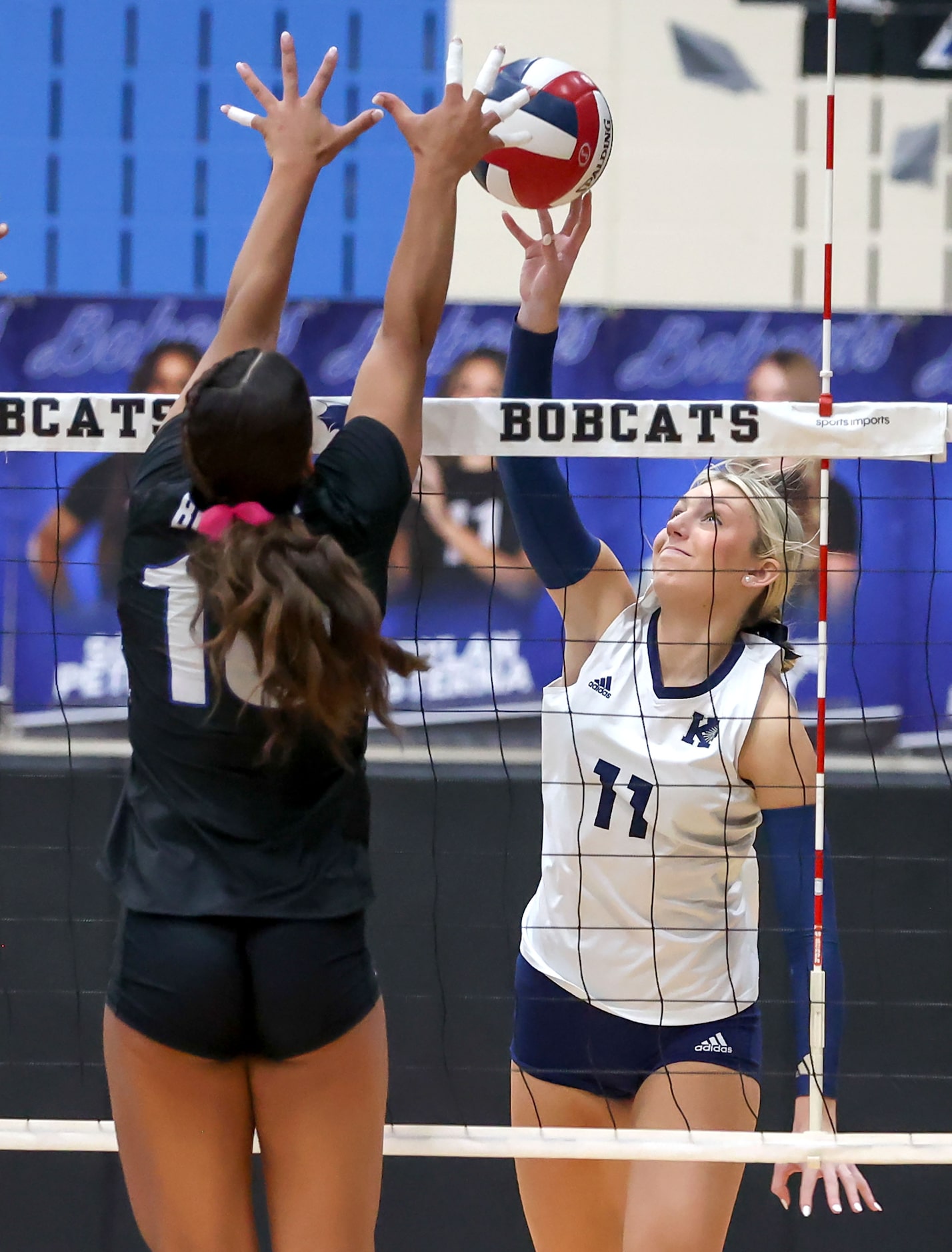 Keller's Brooklyn Harter (11) tries to get the ball over Byron Nelson's Sophee Peterson...