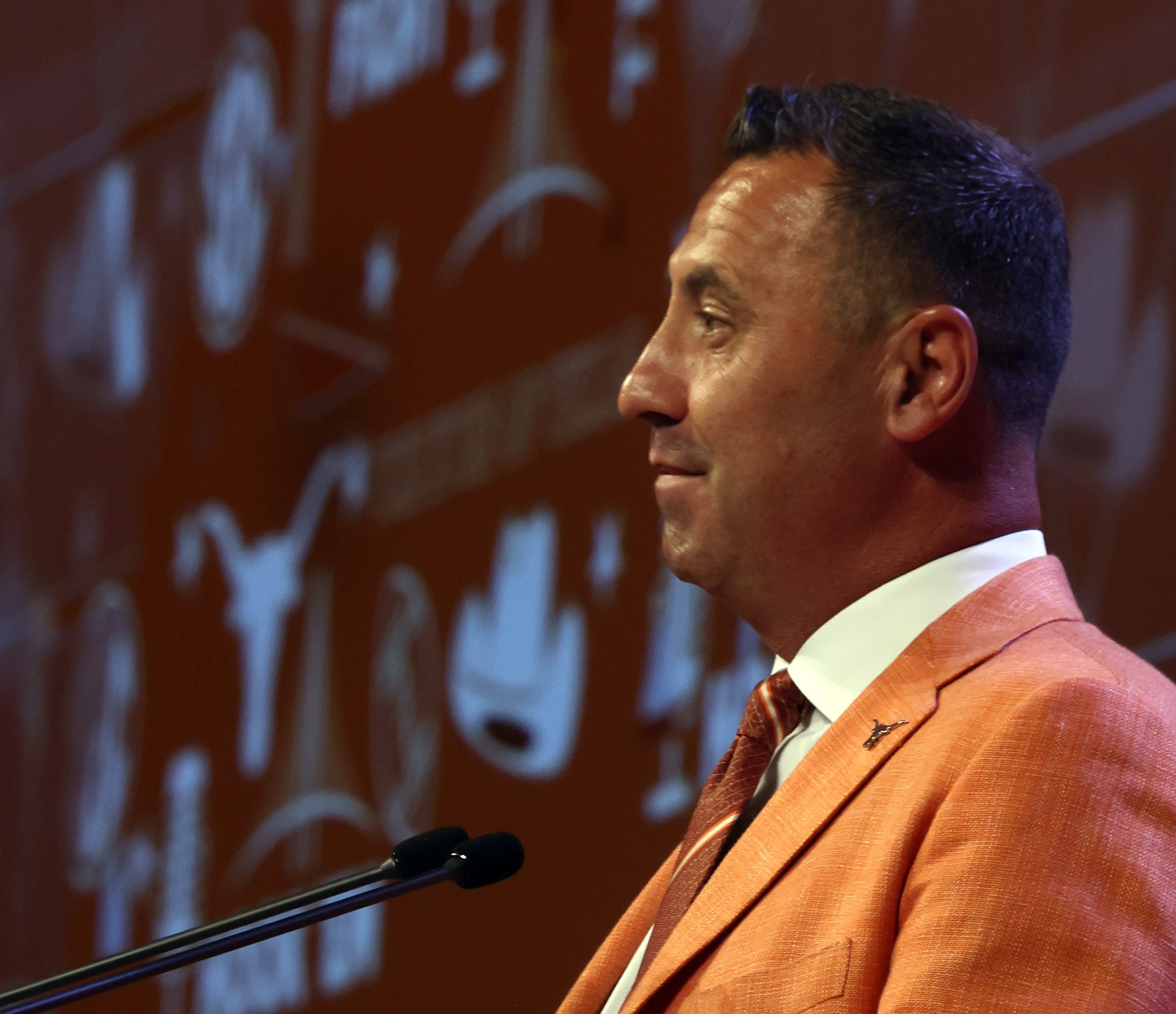 Texas Longhorns head football coach Steve Sarkisian listens to a question from a media...