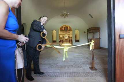 Paun Peters cut the ribbon at the opening of a Byzantine-style church building of St. John...
