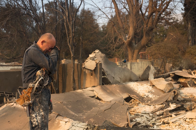 Cesar Plaza becomes emotional while looking at his home destroyed by the Eaton Fire in...