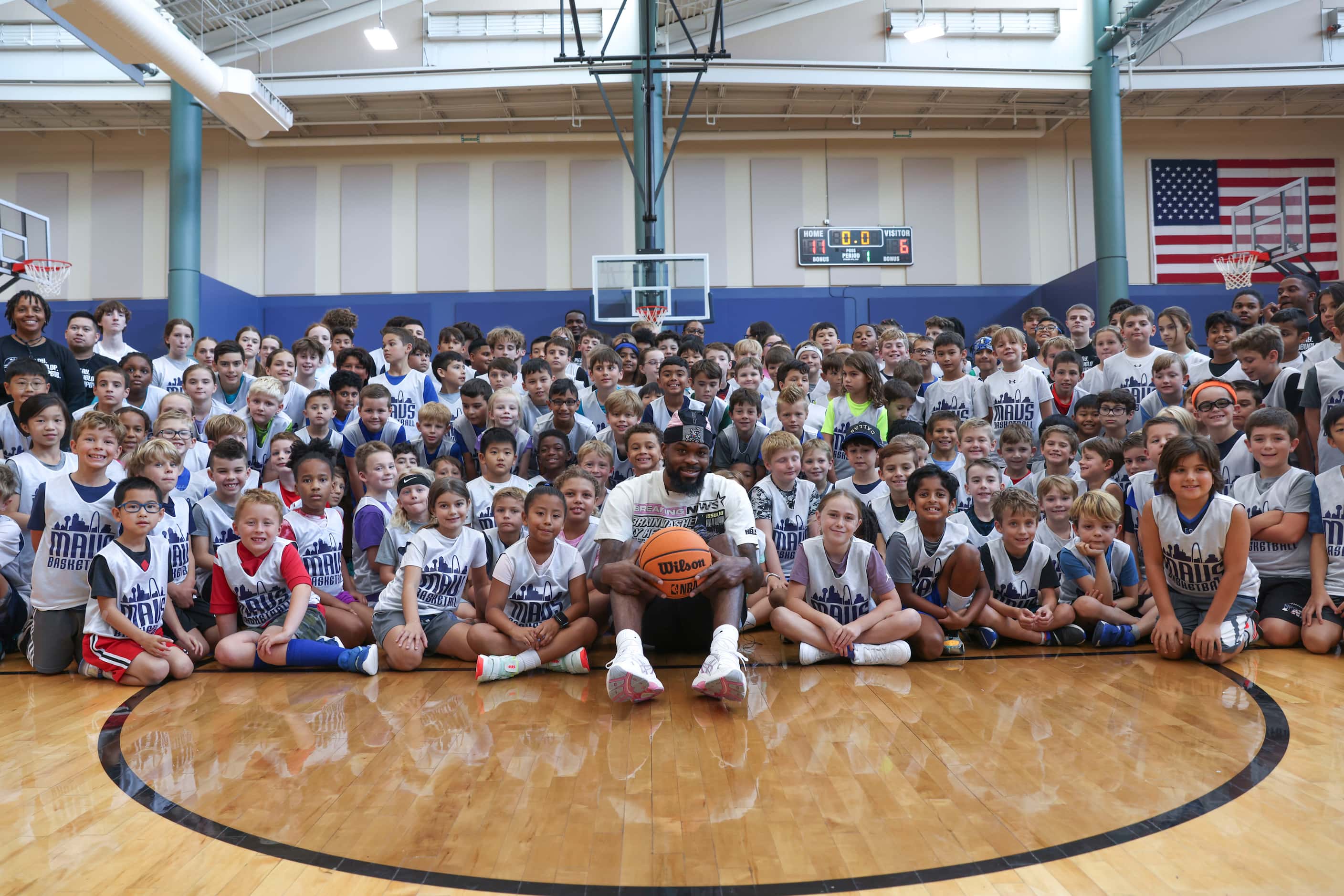 Dallas Mavericks’ Naji Marshall, poses with young basketball campers during a Hoop Camp,...