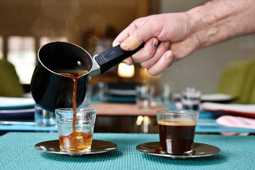 Israeli Chef Eldad Jacobson pours Turkish coffee. He adds hawaij after pouring. 
