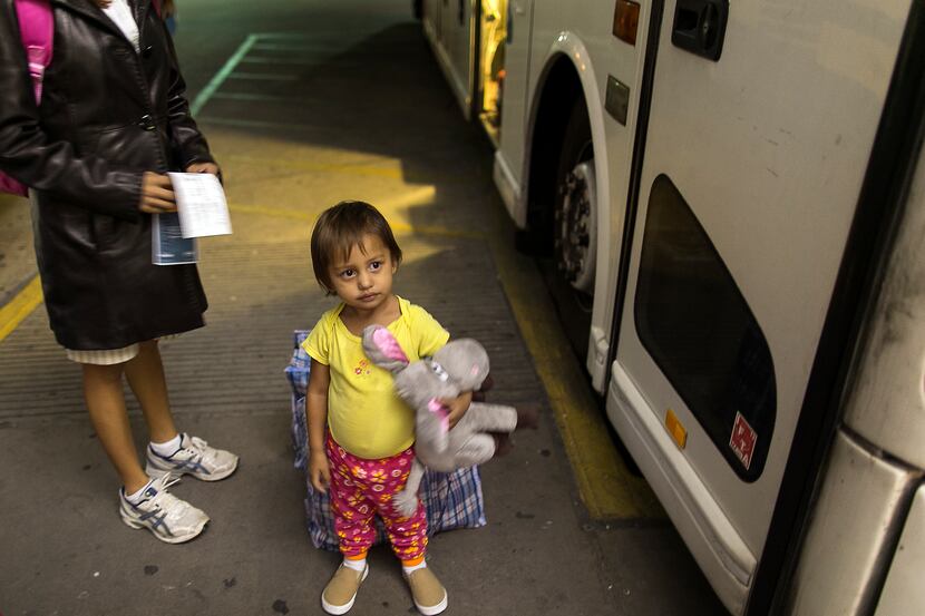 2-year-old Adriana Ortez holds her stuffed animal, as she and her mother, Dayana Ortez of El...