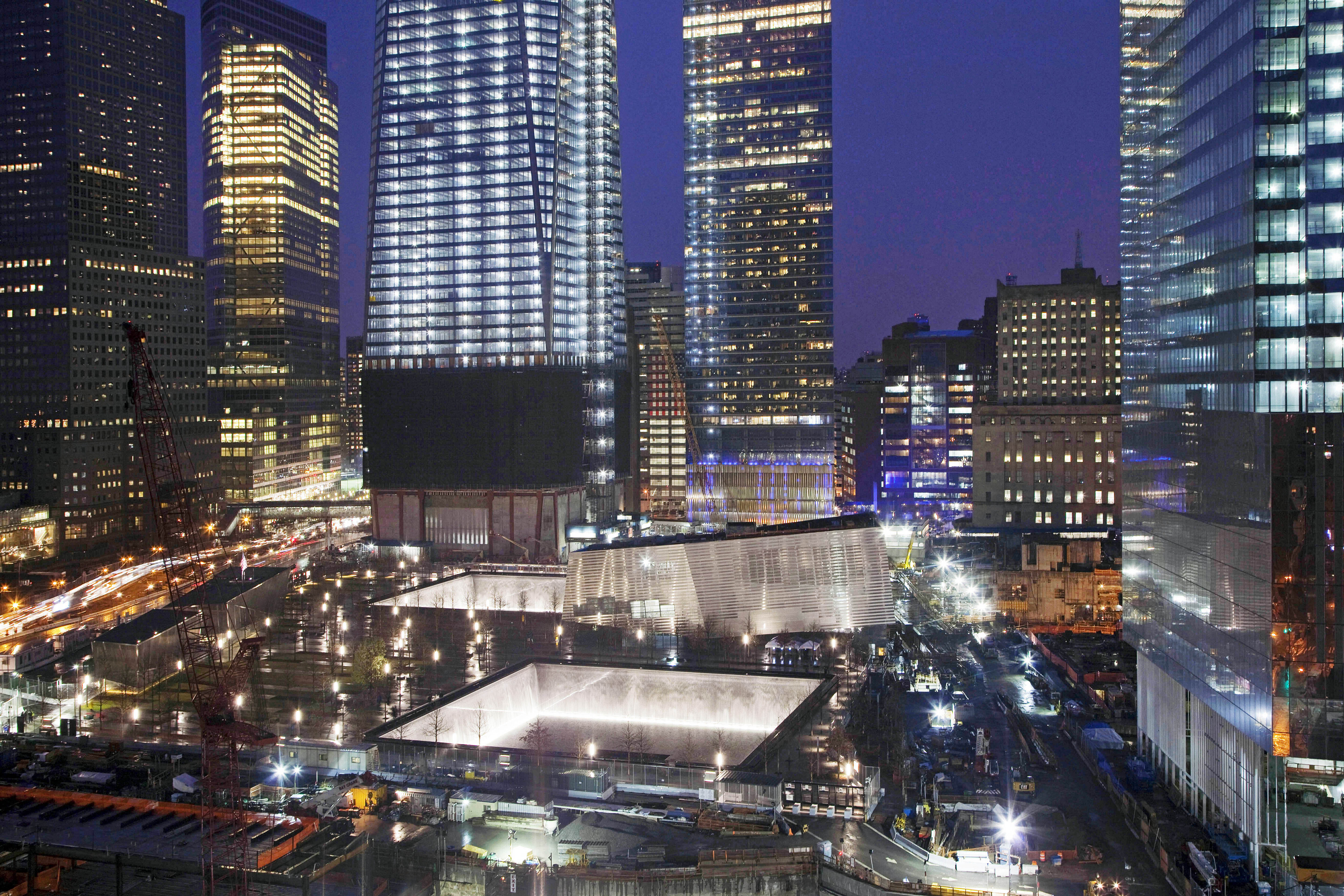 FILE — The twin reflecting pools, center, of the National September 11 Memorial are...