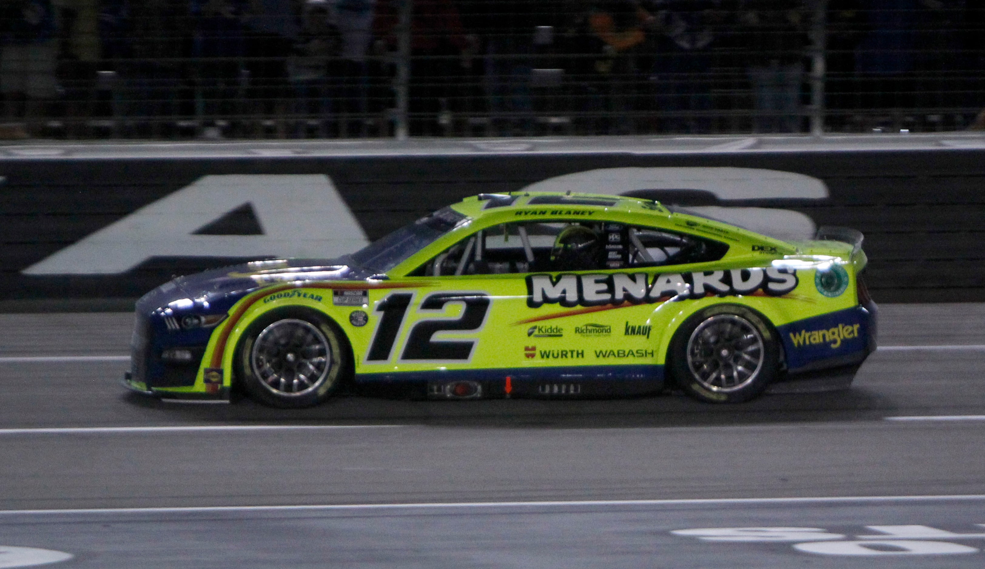 Ryan Blaney, driver of the #12 Menards / Wrangler Ford car finishes first to capture a trip...