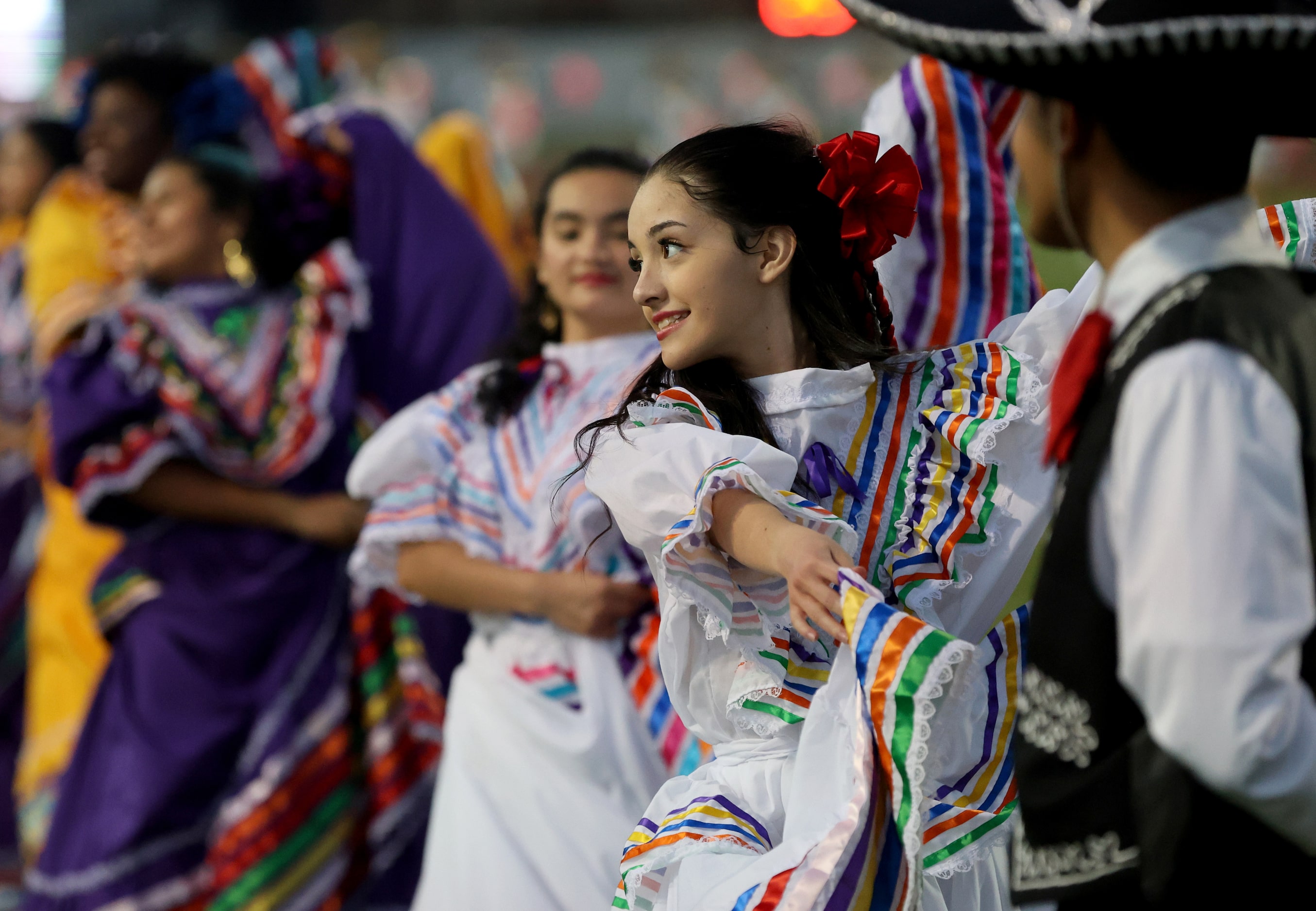 Addy Woolf of the dance team Dance Folklorico performs before the District 7-6A high school...