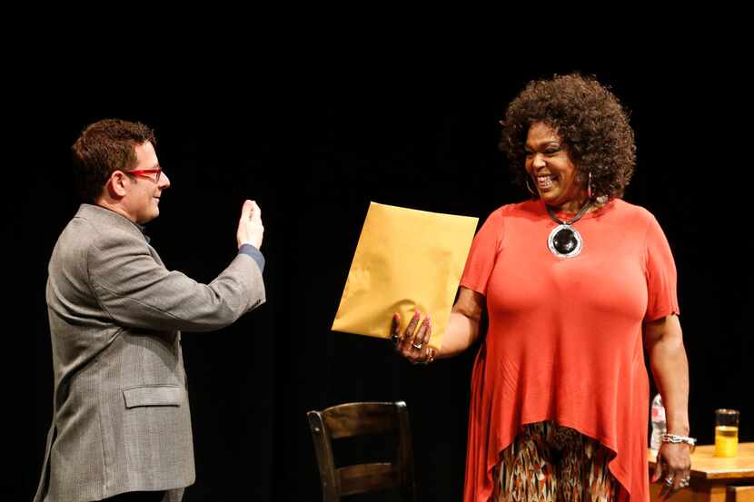 Kevin Moriarty, artisitic director, hands Liz Mikel the script for a production of 'White...