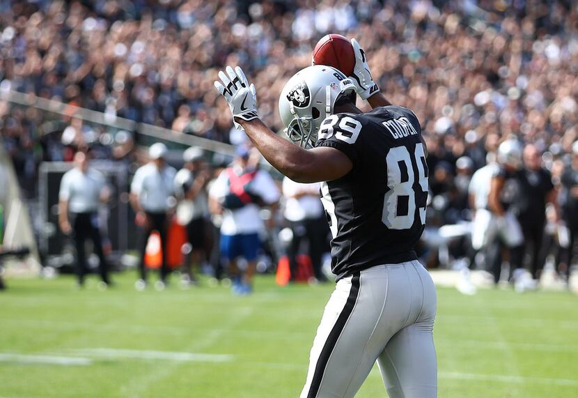 Oakland Raiders fans don matching holiday outfits during the first