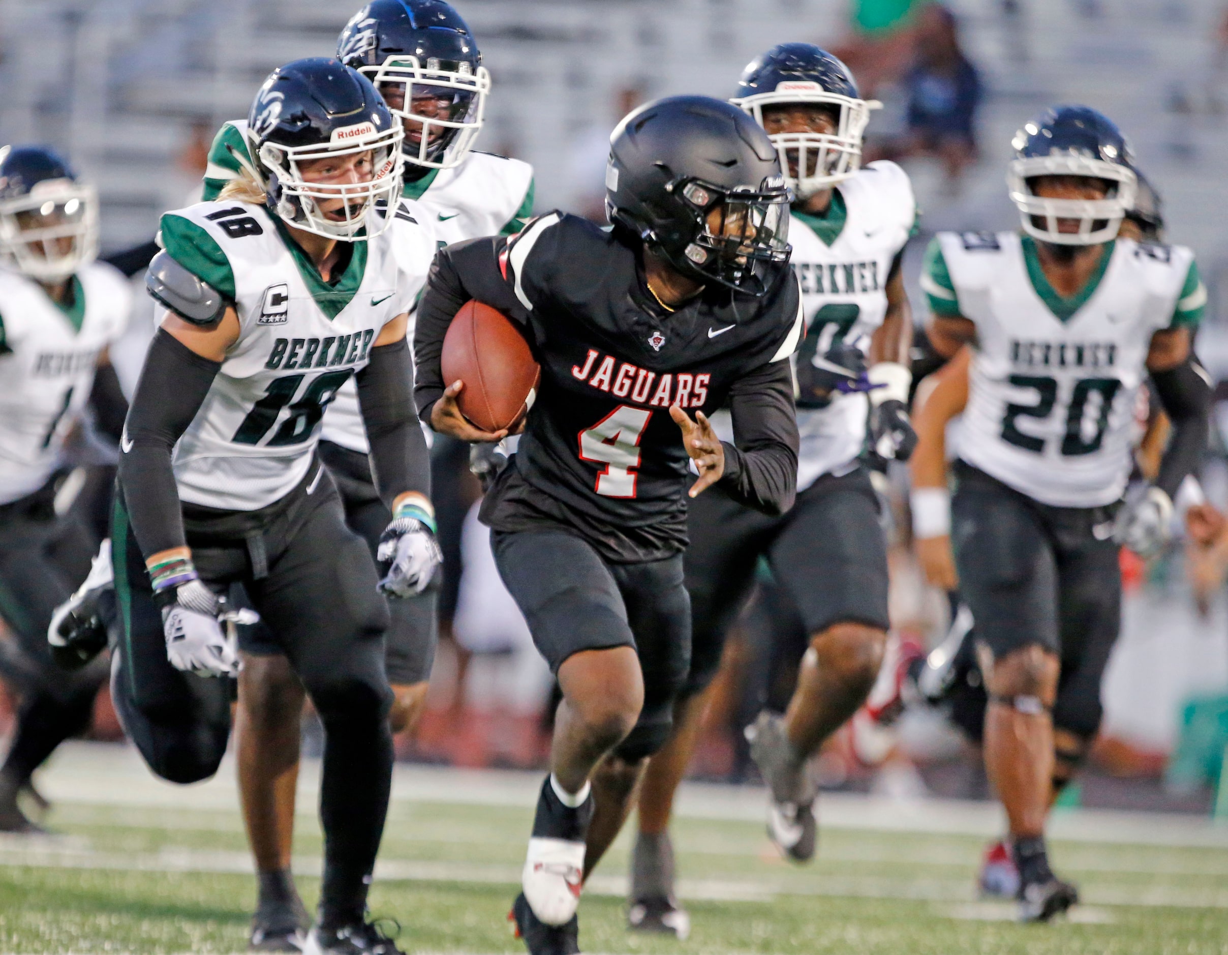 Mesquite Horn high WR Cedonyae Lott (4) outruns the Richardson Berkner High defense to the...