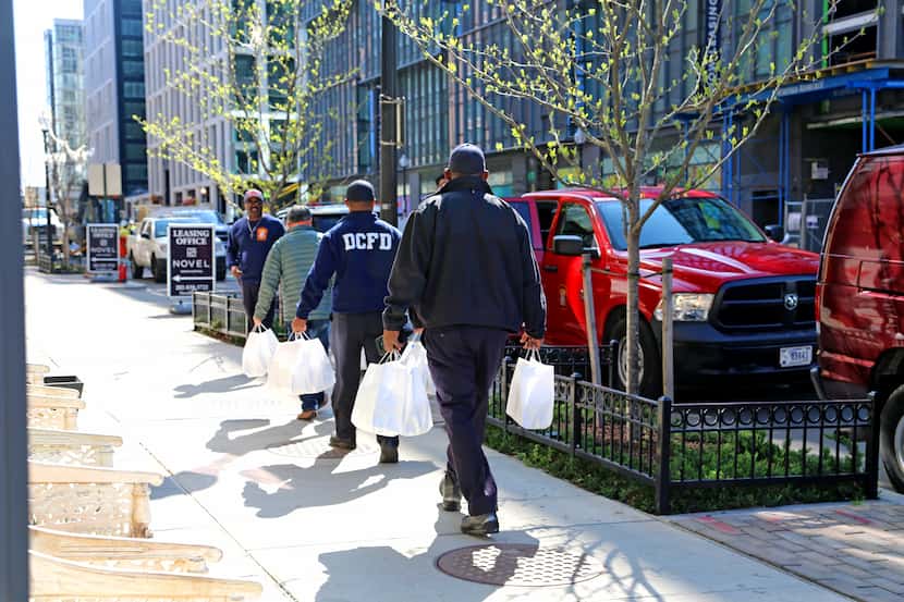 D.C. firefighters deliver meals as part of the Power of 10 Initiative.