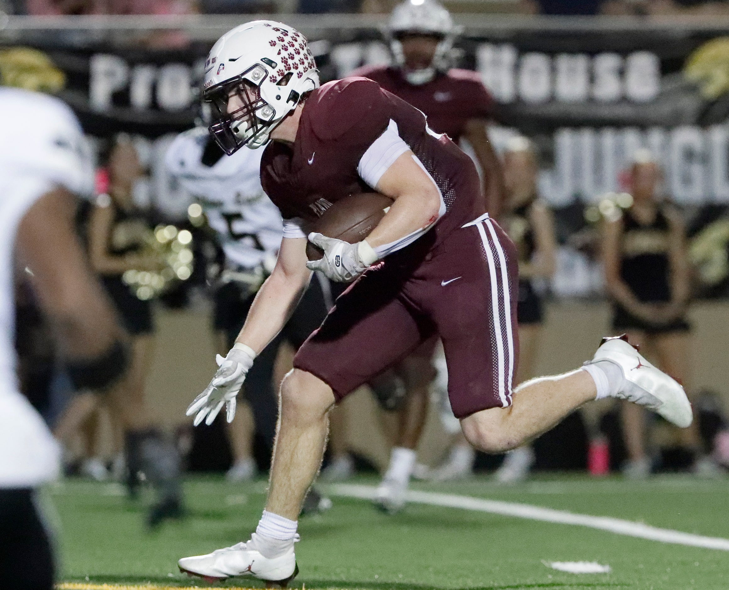 Plano High School running back Chance Culley (25) runs the ball close to the goal line...