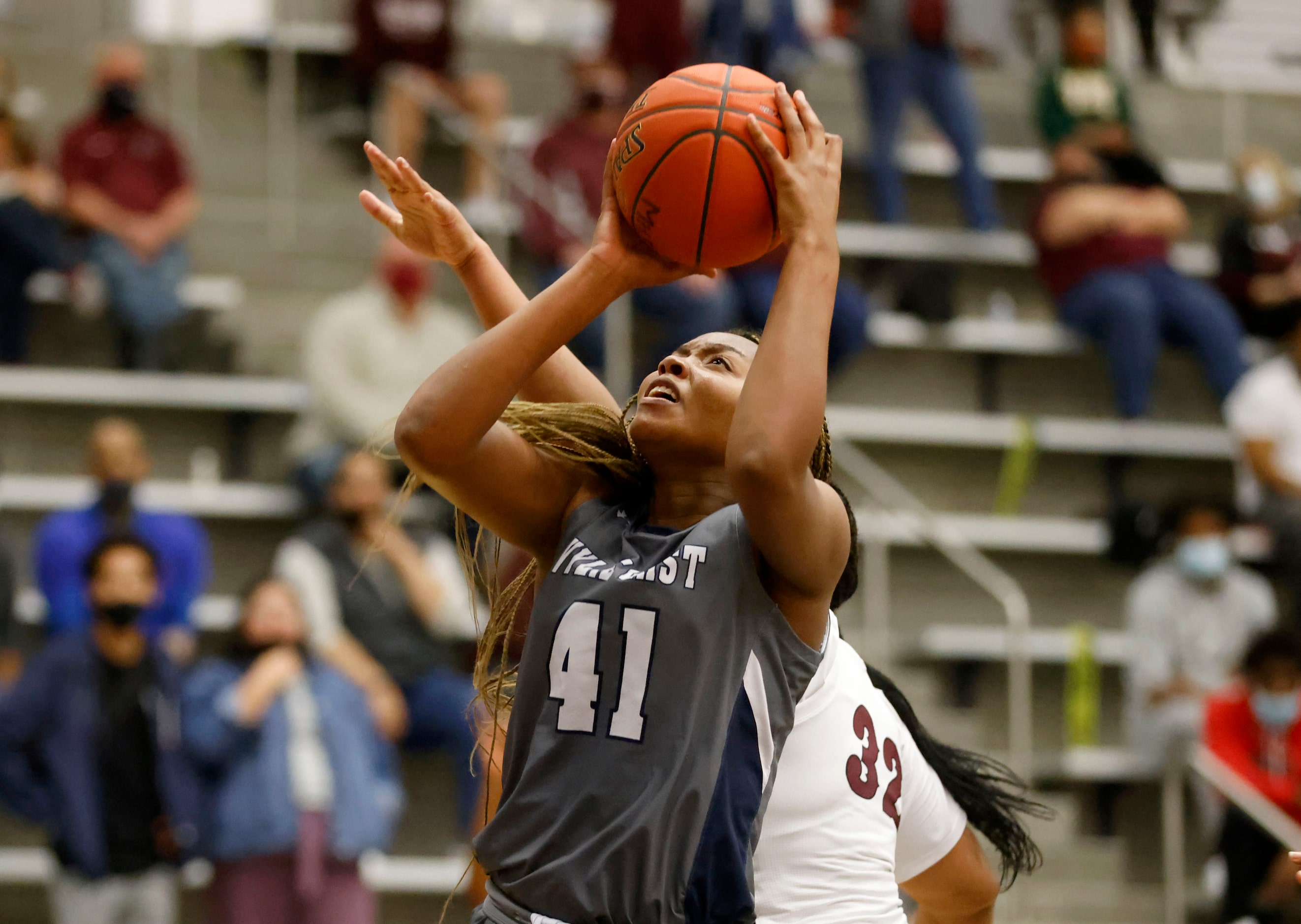 Wylie East’s Akasha Davis (41) scores a basket against Red Oak during the Class 5A Region II...