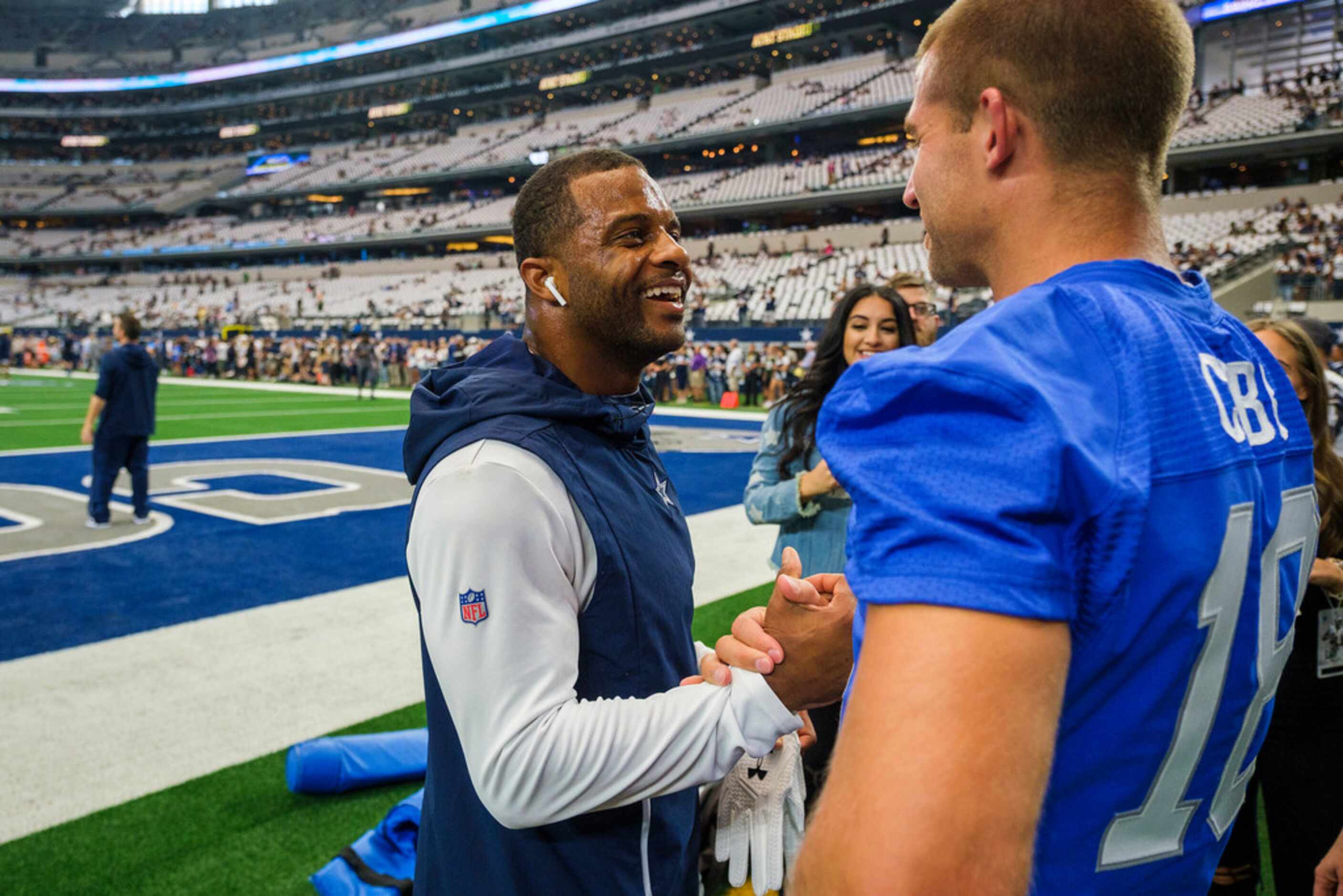 Dallas Cowboys wide receiver Randall Cobb (left) laughs with former teammate, retired Green...