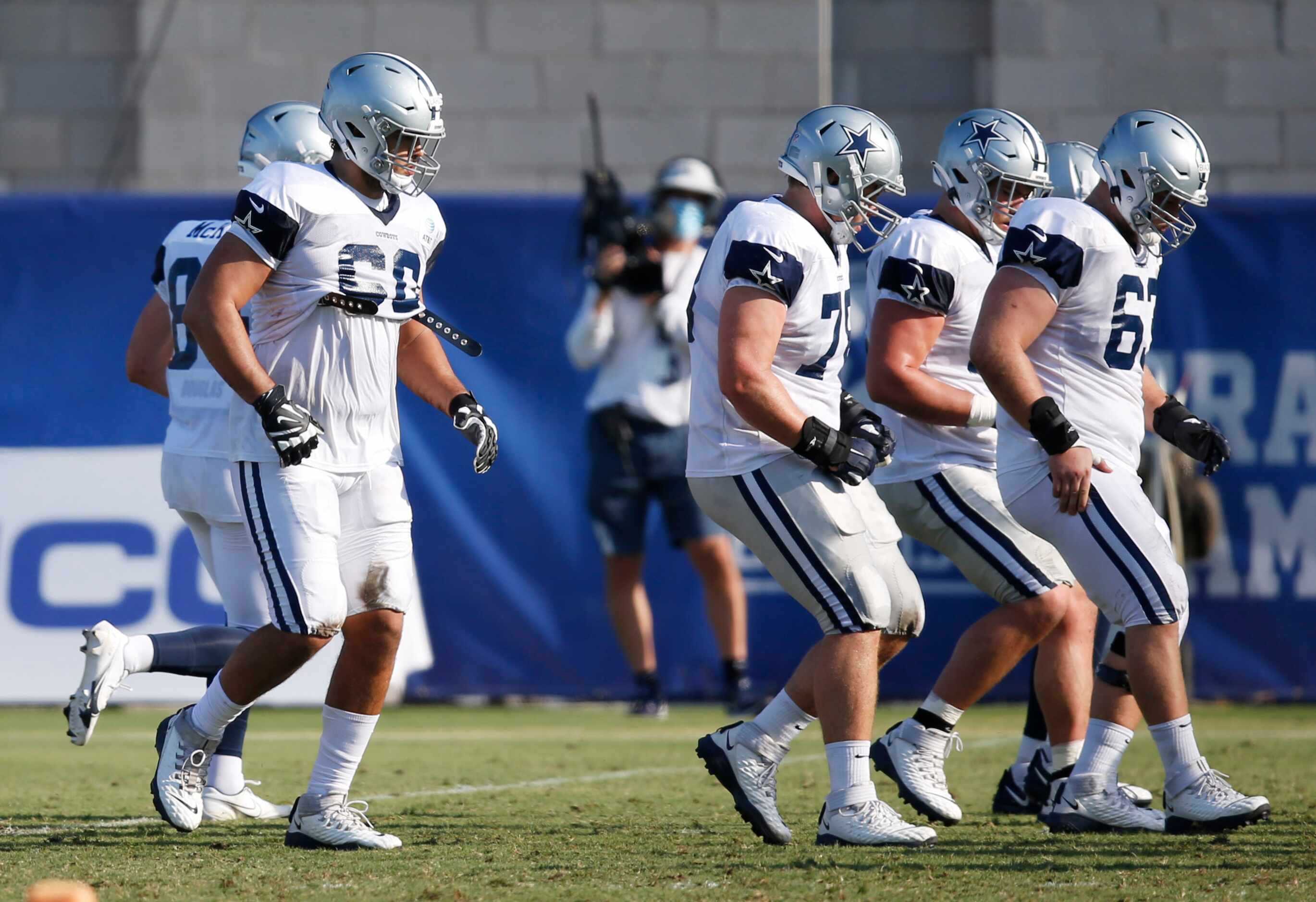 Dallas Cowboys offensive tackle Isaac Alarcón (60) lines up before the play during training...