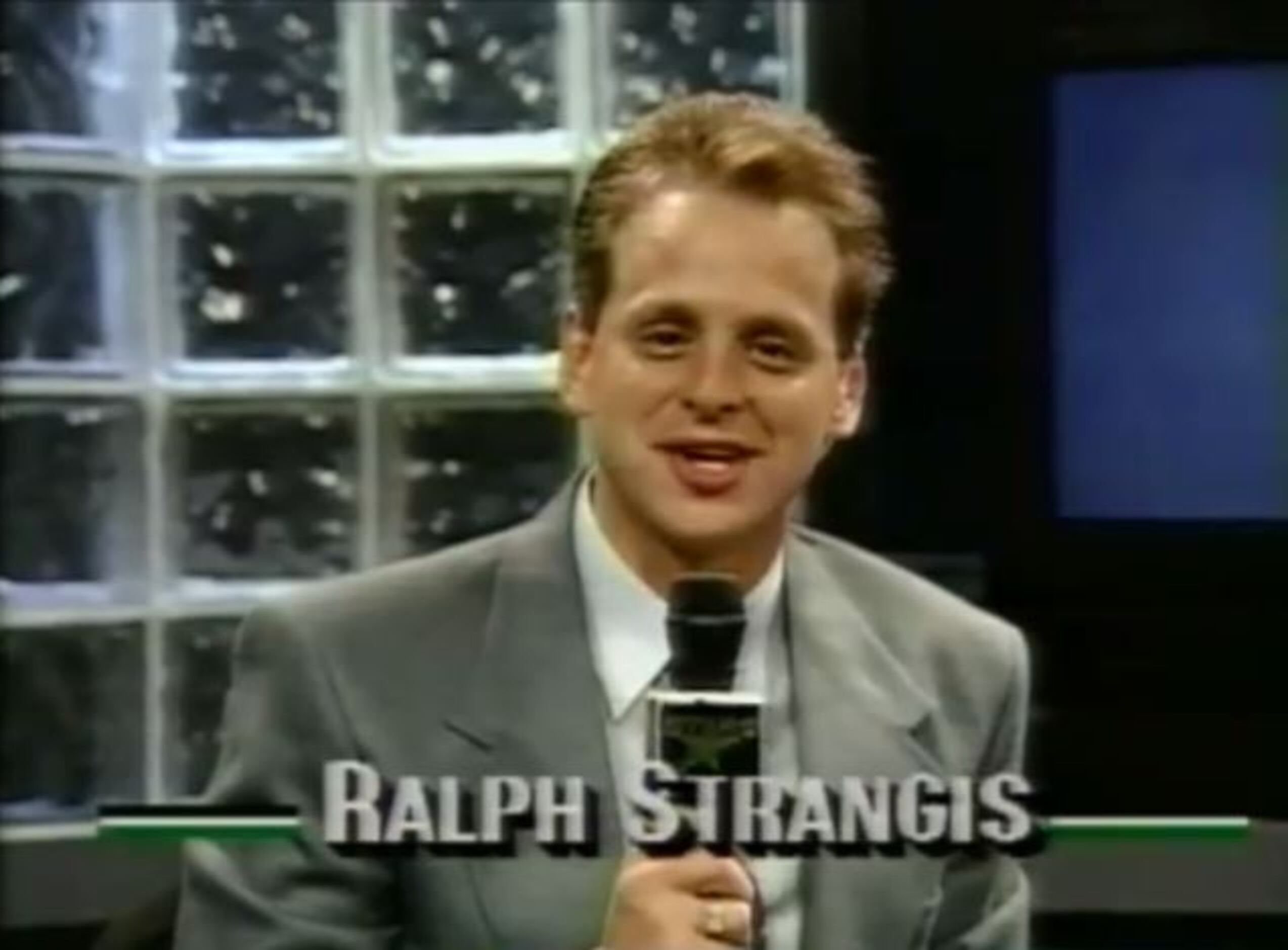 1563Dallas Stars play-by-play announcer Ralph Strangis with Tina