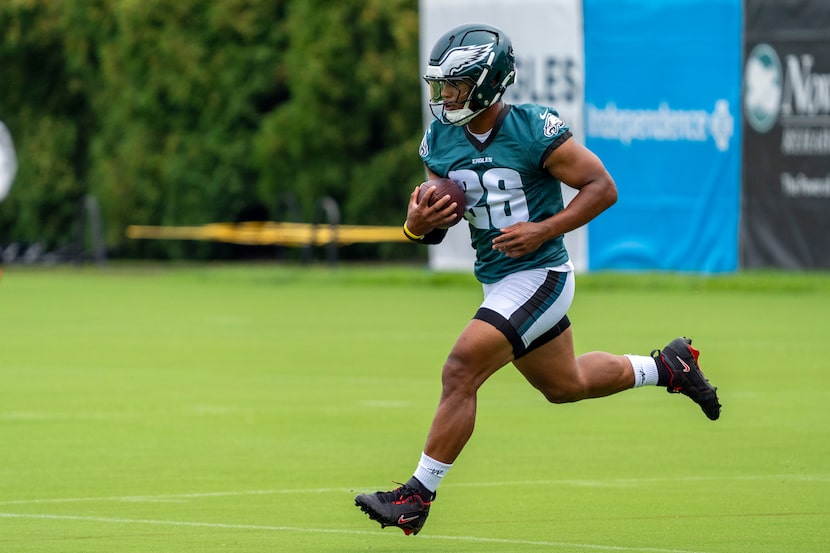 Philadelphia Eagles running back Saquon Barkley runs a drill during practice at NFL football...