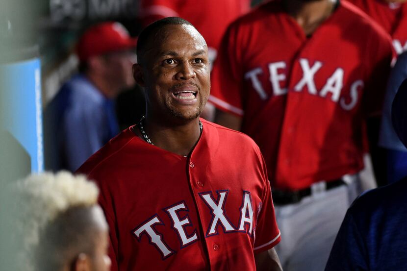 Texas Rangers' Adrian Beltre reacts as he watches the replay of an error by Chicago White...