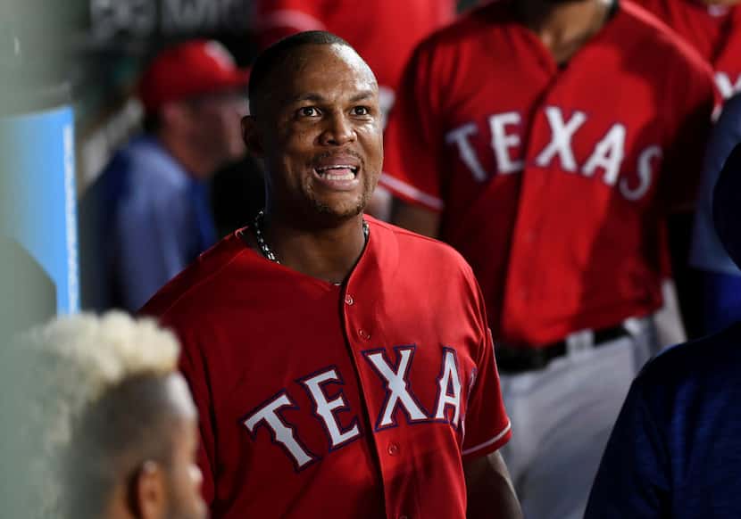 Texas Rangers' Adrian Beltre reacts as he watches the replay of an error by Chicago White...