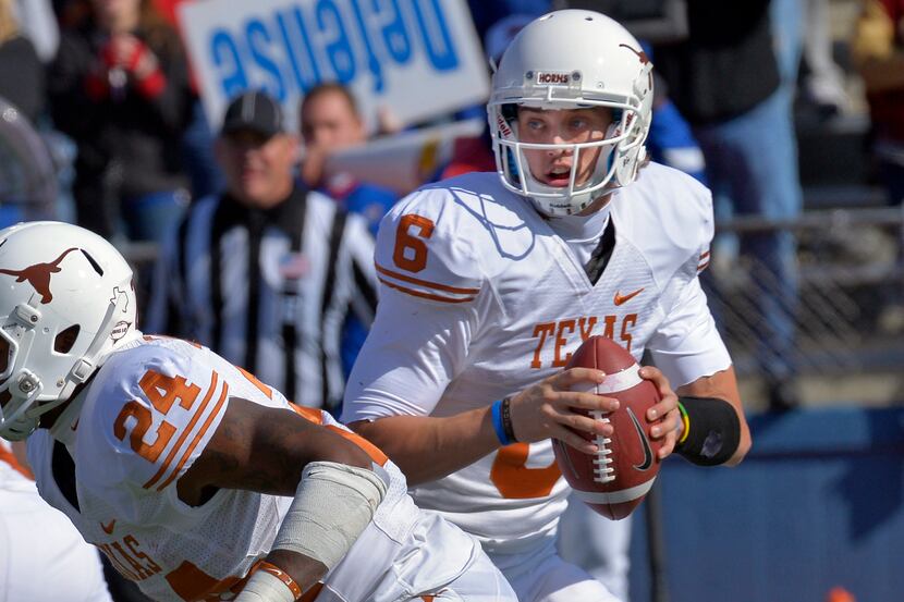 Texas quarterback Case McCoy (6) looks for Texas tight end D.J. Grant (18) in the end zone...