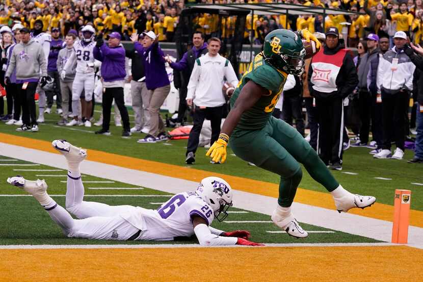 Baylor tight end Kelsey Johnson (87) scores a touchdown against TCU safety Bud Clark (26)...