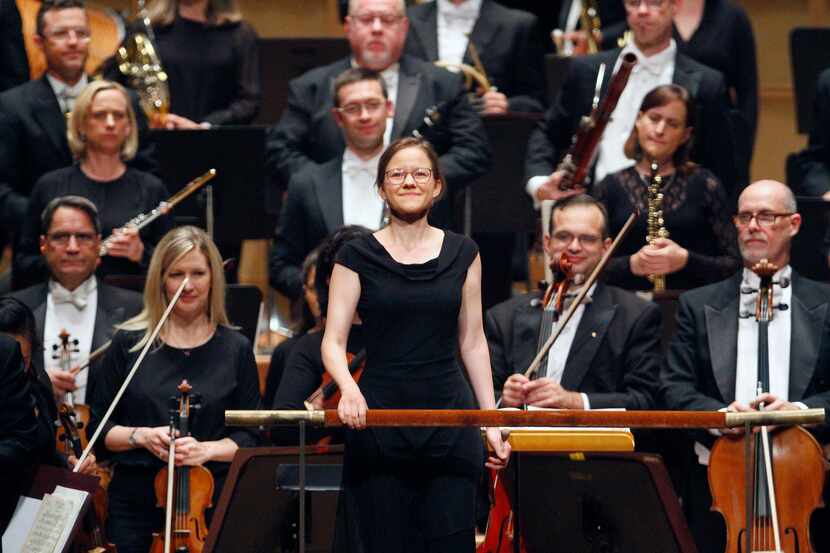 Conductor Katharina Wincor reacts with a smile as she's introduced to conduct the Dallas...
