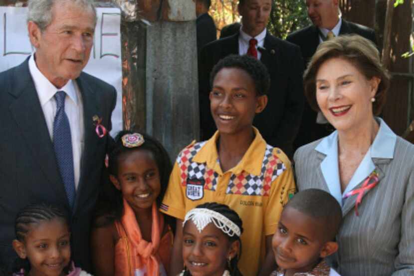 Former President George W. Bush and his wife, Laura, visited a U.S.-funded hospital treating...