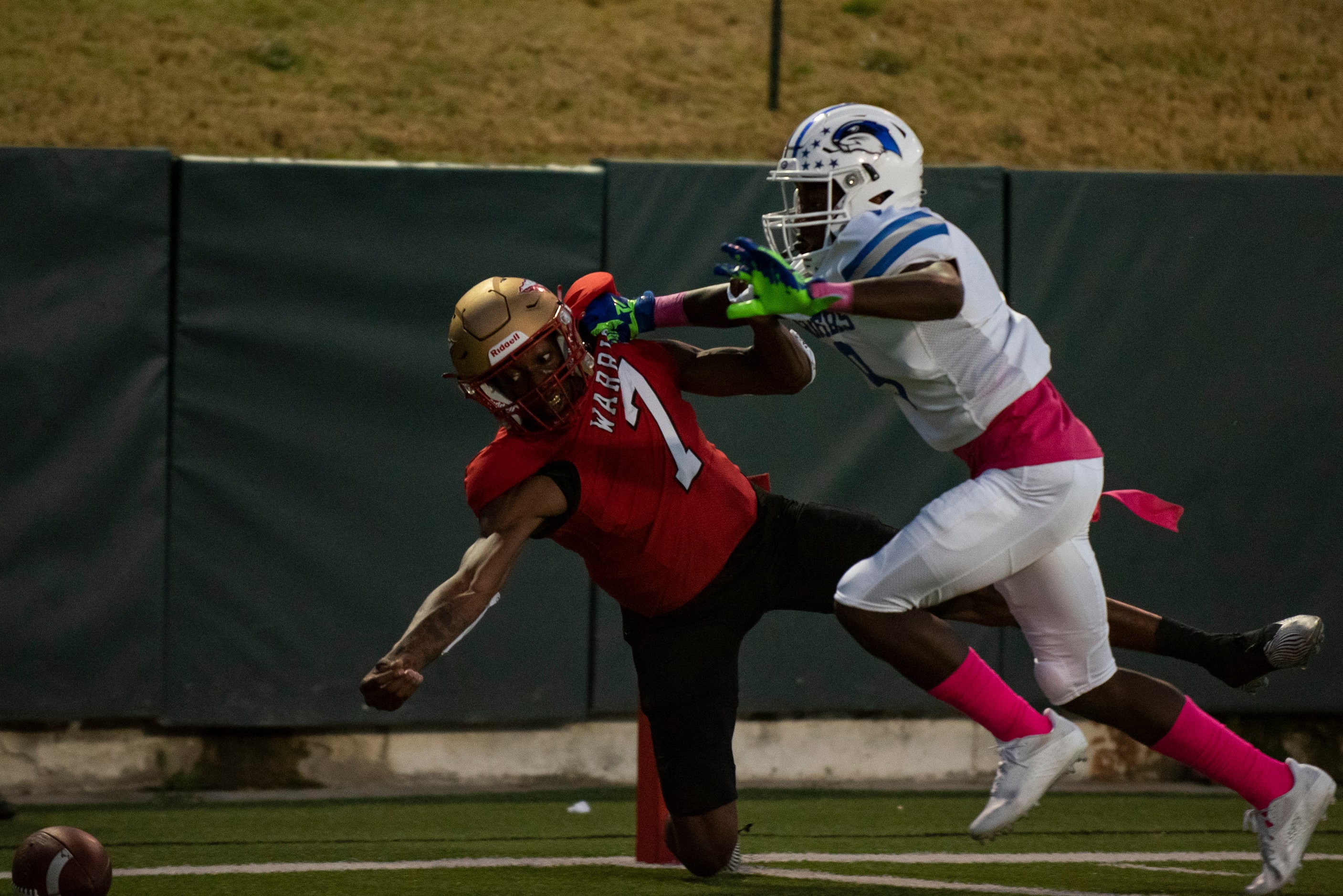 South Grand Prairie senior Michael Stallworth (7) is pushed out of bounds while reaching for...