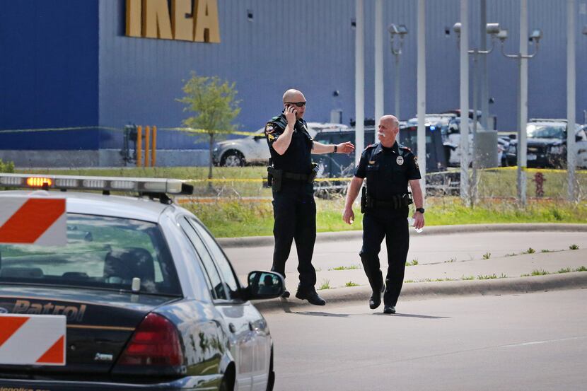Grand Prairie police officers at the scene of a confrontation with an armed man  near the...