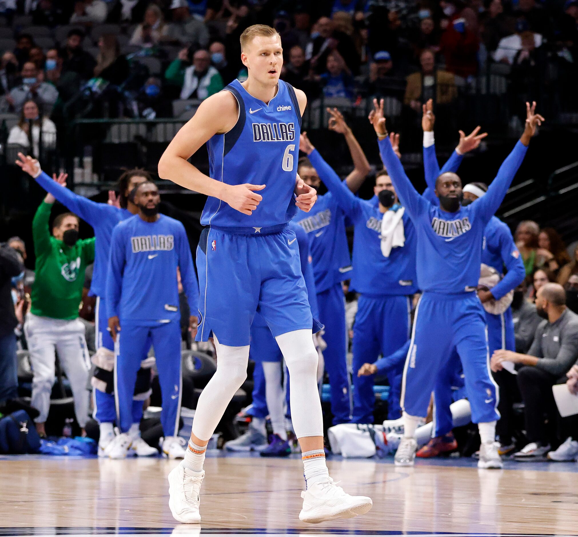 The Dallas Mavericks bench celebrates Dallas center Kristaps Porzingis (6) three-pointer in...