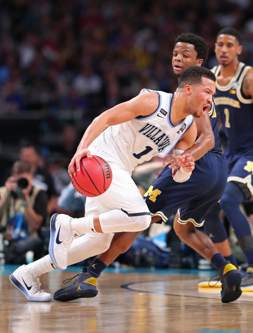 SAN ANTONIO, TX - APRIL 02: Jalen Brunson #1 of the Villanova Wildcats is defended by Zavier...