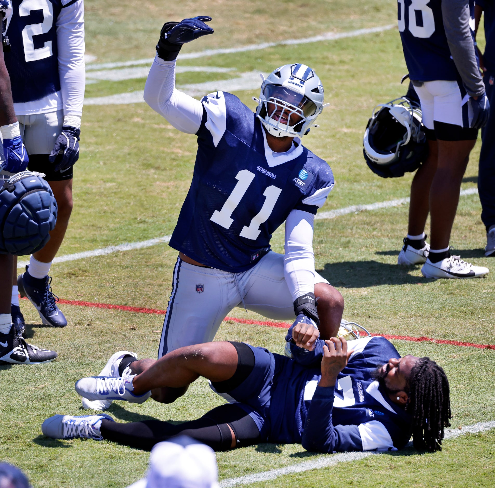 Dallas Cowboys linebacker Micah Parsons (11) encourages the fans to cheer after dropping on...