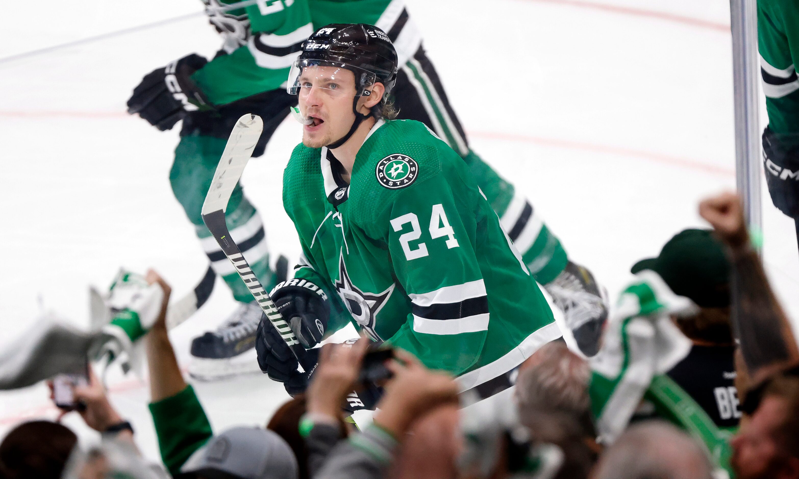 Dallas Stars Roope Hintz smiles as he skates to the bench following his third quarter hat...