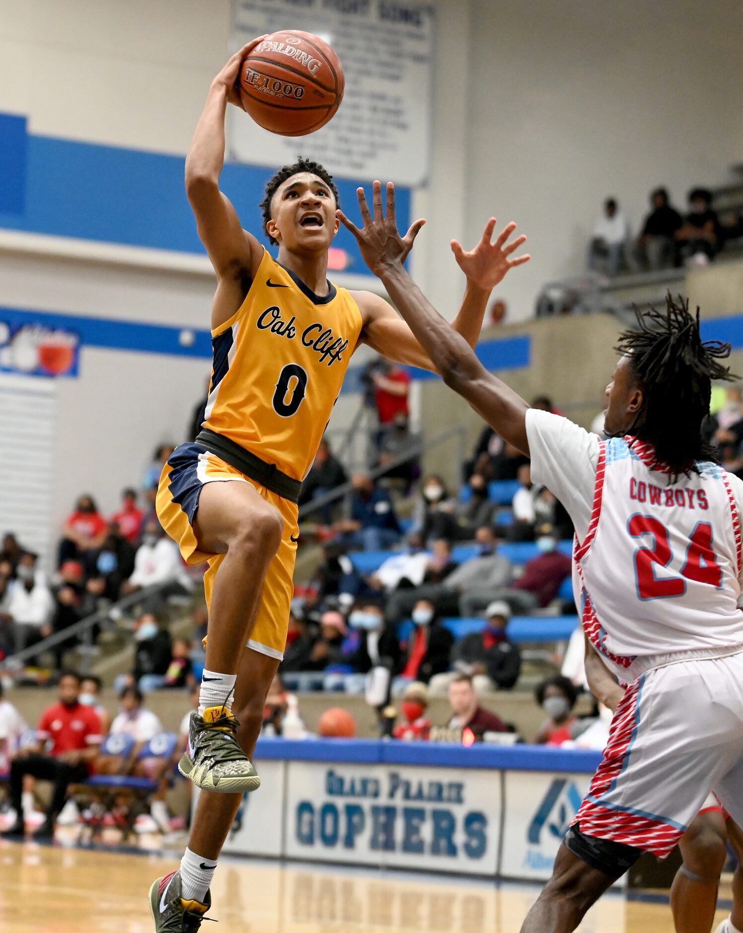 Faith Family’s Dallas Hobbs (0) drives to the basket on Carter’s Erin Wright in the second...