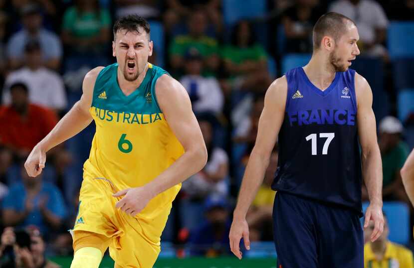 Australia's Australia's Andrew Bogut (6) reacts in front of France's Kim Tillie (17) after...