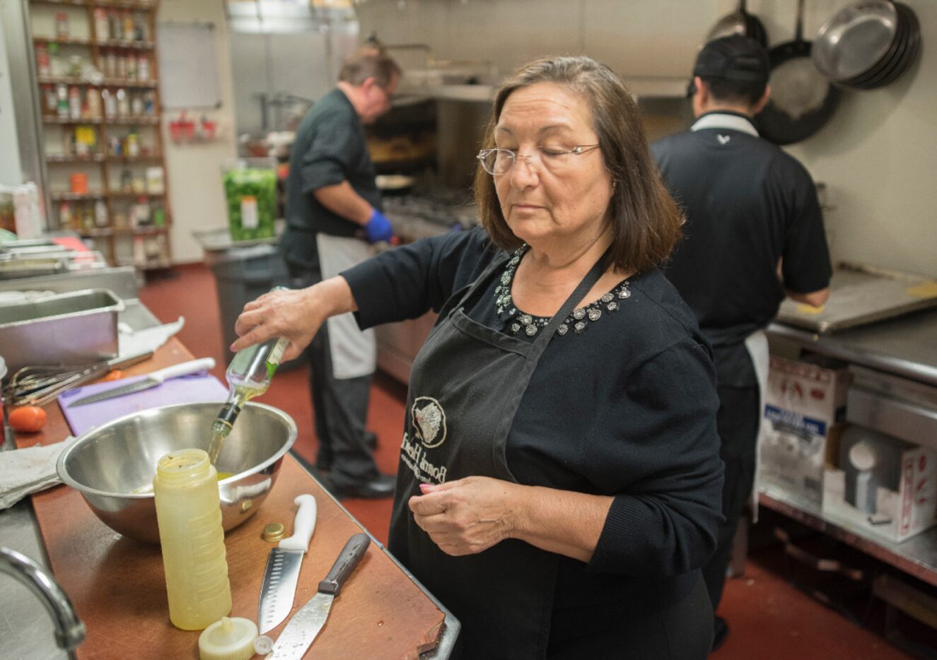 Semira Pacifico prepares a vinaigrette dressing at the Italian Club of Dallas.