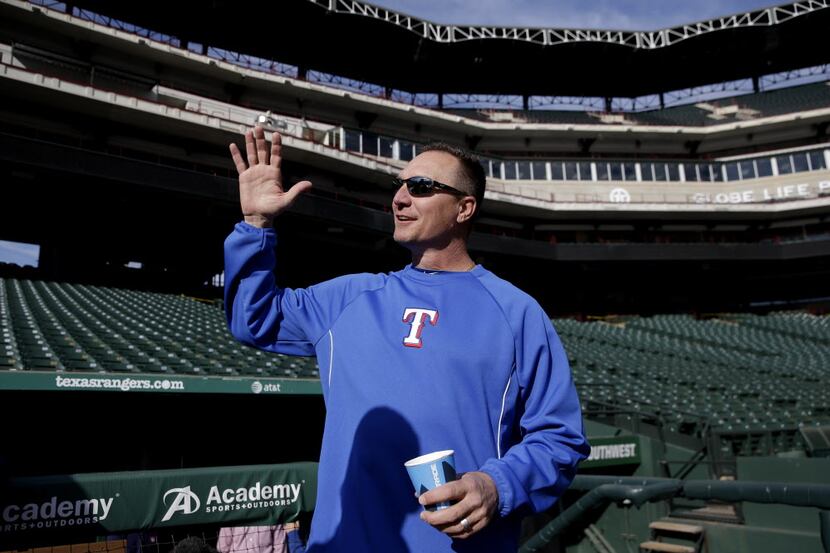 Texas Rangers manager Jeff Banister chats with reporters during a winter camp baseball...