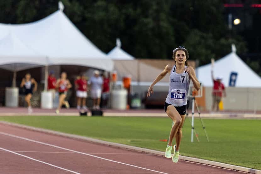 Natalie Cook of Flower Mound races in the girls’ 1600-meter final at the UIL Track & Field...